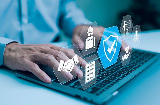 Businessman typing on laptop with virtual icons representing work safety, compliance, and security, workplace safety, and regulatory adherence.