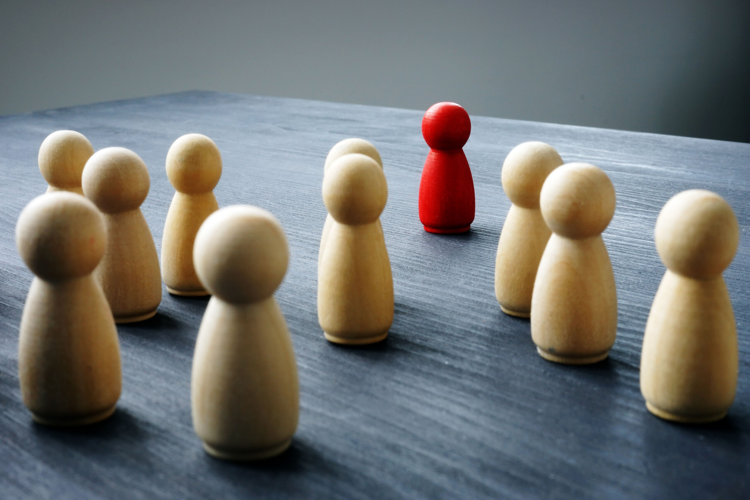 Wooden figures on a desk.